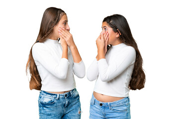 Friends girls holding gift and a birthday cake over isolated chroma key background covering mouth with hands for saying something inappropriate - obrazy, fototapety, plakaty