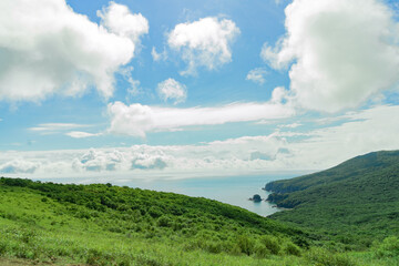 Fototapeta premium view from the height of the sea and green hills