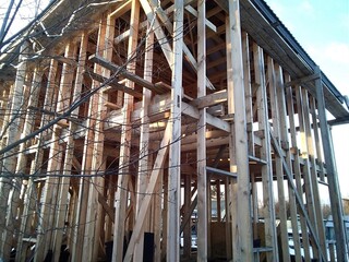 Panoramic interior view of a wooden timber frame from a new house under construction