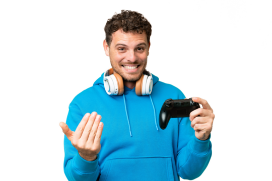 Brazilian man playing with a video game controller over isolated chroma key background inviting to come with hand. Happy that you came