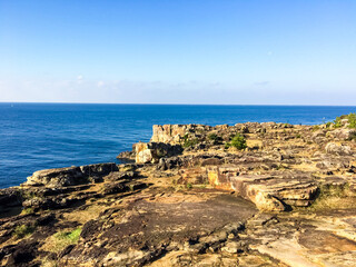 Fototapeta premium Sandanbeki cliff and sea at winter sunny day, Nanki shirahama, Wakayama, Japan