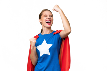 Young caucasian woman over isolated background in superhero costume and celebrating a victory