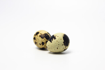 Quail Eggs Kissing Each Other, Pareidolia Effect on Quail eggs. Isolated on White