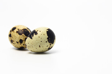 Quail Eggs Kissing Each Other, Pareidolia Effect on Quail eggs. Isolated on White. Right  copy space