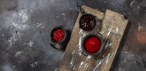 grilled barbeque sauce, with spices on a wooden background. cooking background. Long banner format....