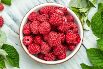 Organic raspberries, Fresh raspberries in bowl. Ripe juicy fresh raspberries. healthy food, vitamins, summer berry fruit. Long banner format. place for text