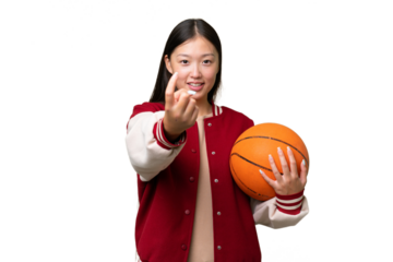 Young basketball player asian woman over isolated background doing coming gesture