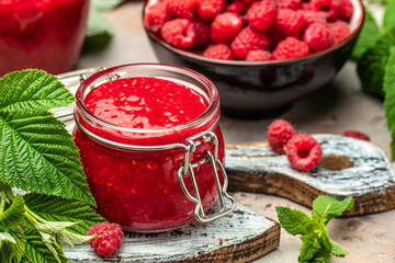 Homemade jam with raspberry on the wooden board. banner, menu, recipe place for text, top view