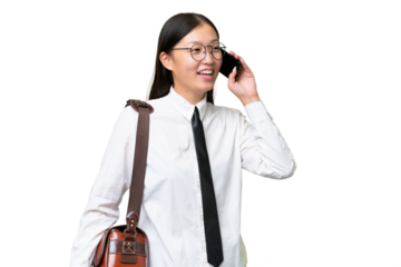 Young Asian business woman over isolated background keeping a conversation with the mobile phone