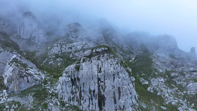 Landscape of mists and rocks in the Castros de Horneo in the Collados del Ason Natural Park. Soba Valley, Cantabria, Spain, Europe