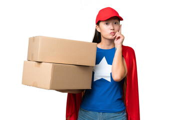 Super Hero delivery Asian woman holding boxes over isolated background thinking an idea