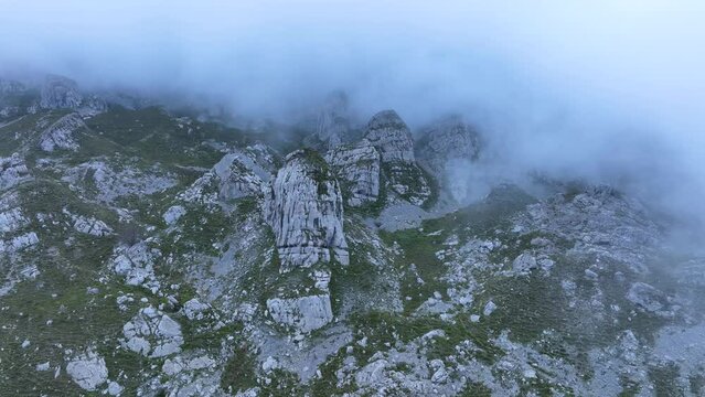 Landscape of mists and rocks in the Castros de Horneo in the Collados del Ason Natural Park. Soba Valley, Cantabria, Spain, Europe