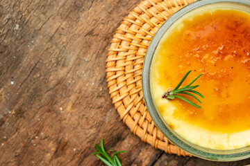French Creme Brulee on a wooden background, Restaurant menu, dieting, cookbook recipe top view