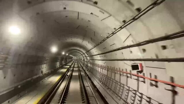Fast moving subway train moving forward. Singapore MRT train in a subway moving forward