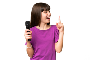 Little singer girl picking up a microphone over isolated background intending to realizes the solution while lifting a finger up