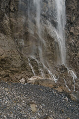 Detail of big waterfall of Gavarnie at massive high rock wall formation in Pyrenees Mountains, Nouvelle-Aquitaine, France