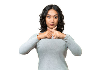 Young Argentinian woman over isolated background showing a sign of silence gesture
