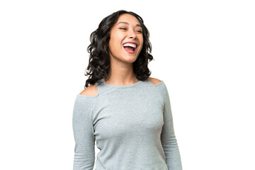 Young Argentinian woman over isolated background laughing