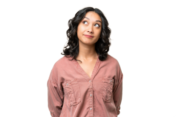 Young Argentinian woman over isolated background and looking up