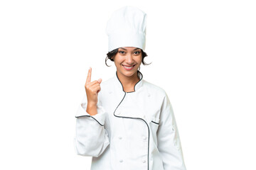 Young chef Argentinian woman over isolated background showing and lifting a finger in sign of the best