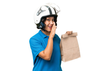 Young Argentinian woman taking a bag of takeaway food over isolated background whispering something