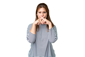 Middle age woman over isolated background showing a sign of silence gesture