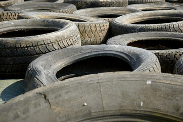 A closeup of old dirty tires with sunlight