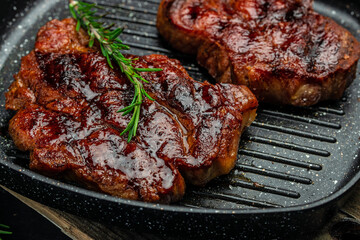grilled pork chops with herbs and spices. Food recipe background. Close up