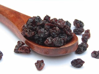 Dried Blackcurrant on a wooden spoon 