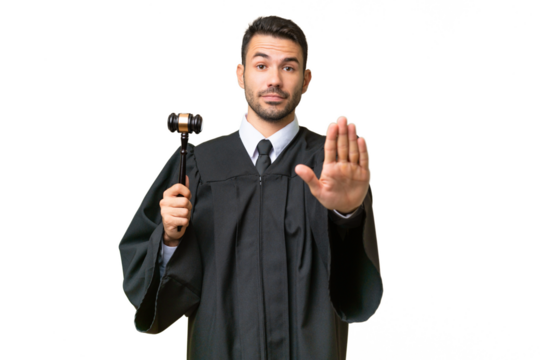 Judge caucasian man over isolated background making stop gesture