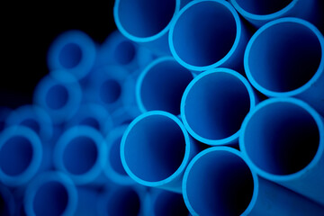 Background of the blue plastic pipes in stacked