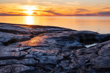 Sunset over the sea and rocky beach. Fäboda, Jakobstad/Pietarsaari. Finland
