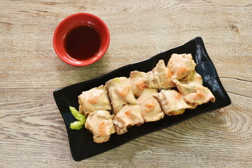grilled beef dressing mayonnaise topping egg shrimp Sushi Japanese food with wasabi dipping soy sauce on plate