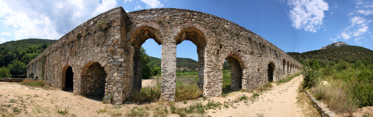 Panoramic view of a roman aqueduct passing Agly river near the village of Ansignan, Occitanie region in France