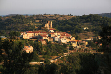 Fototapeta na wymiar The small village of Le Vivier with its medieval castle ruin in the morning, Occitanie in France