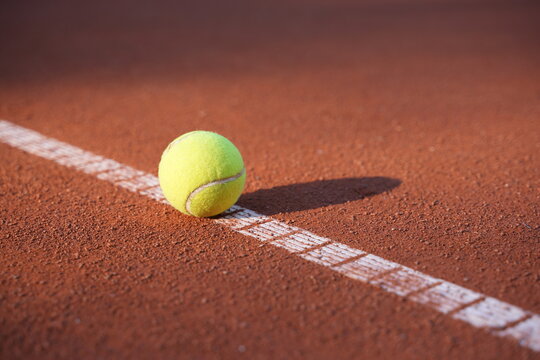 tennis ball on the clay court outdoor sport activity