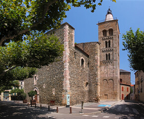Fototapeta na wymiar Romanesque church of St Pierre with its ancient bell tower in the old town of Prades, Pyrénées-Orientales in France