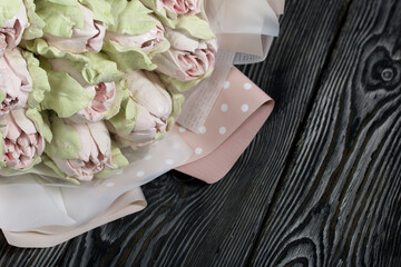 Marshmallow bouquet. Zephyr tulips. Natural homemade marshmallow. Packed in paper in the form of a...