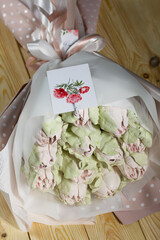 Marshmallow bouquet. Zephyr tulips. Natural homemade marshmallow. Packed in paper in the form of a...