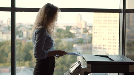 secretary sending fax in office