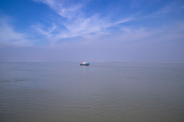 Traditional Travel Boat aginest blue sky in Padma river - Bangladesh