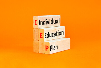 IEP individual education plan symbol. Concept words IEP individual education plan on wooden blocks on beautiful orange background. Business IEP individual education plan concept. Copy space