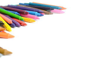 Crayons lined up isolated on white background.