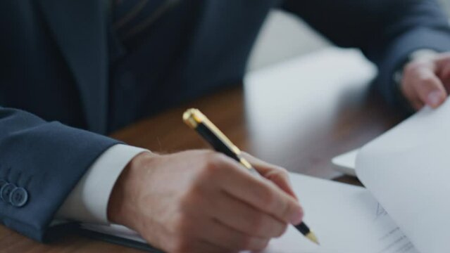 Ceo manager putting signature on documents with deal closeup. Man signing papers