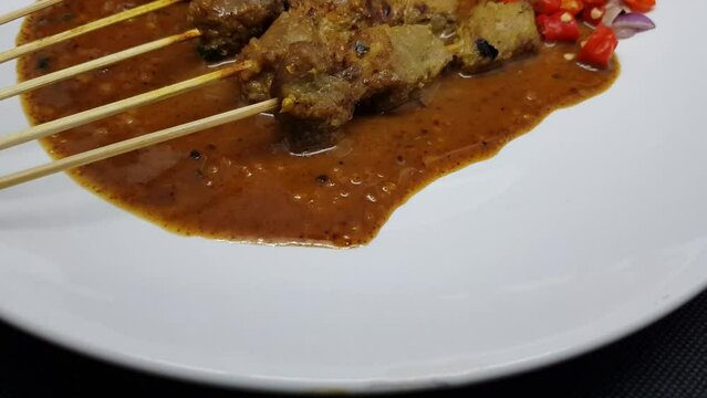 eef satay or Indonesian sate sapi grilled with peanut and soy sauce