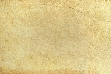 mustard yellow plaster wall texture background,pastel yellow background from cement wall...