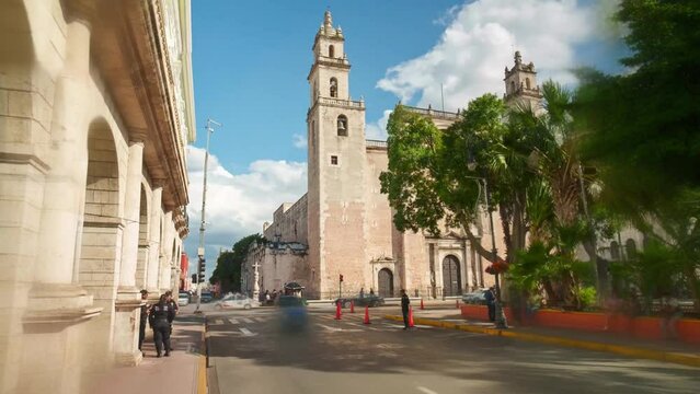 Merida, Yucatan, Mexico motion hyperlapse or timelapse of the Cathedral Ildefonso, at 4K Time Lapse showing traffic and people moving.