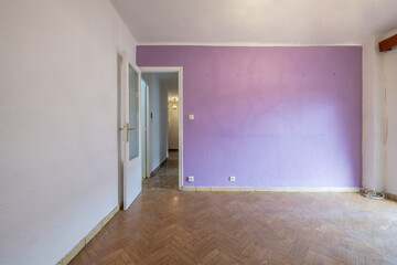 Empty room with two tone fuchsia paint and old dirty floor
