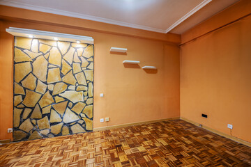 Empty room with peach colored walls, absurd stonework on the wall, oak joinery and checkerboard...