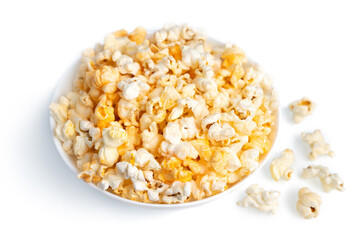 Tasty cheese popcorn in bowl isolated on white background close up. Movies, cinema and entertainment concept.
